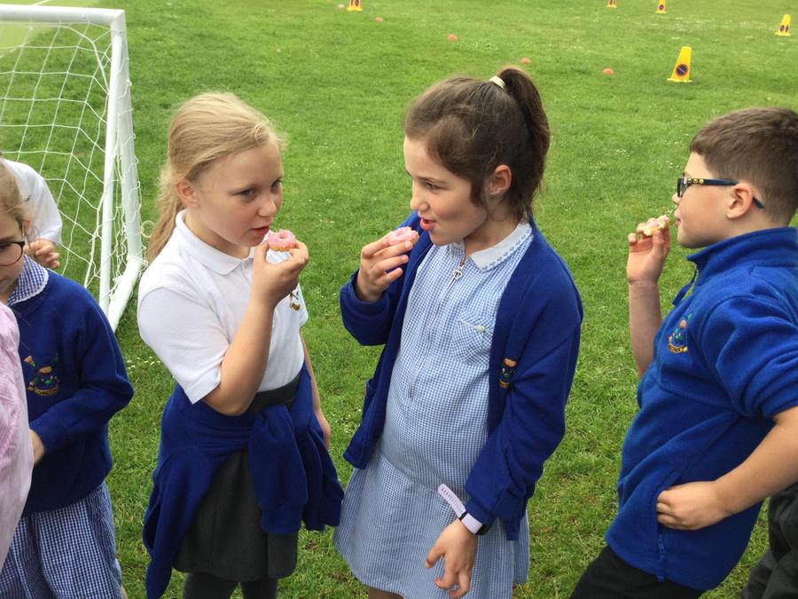 Children enjoying 'holy doughnuts'.